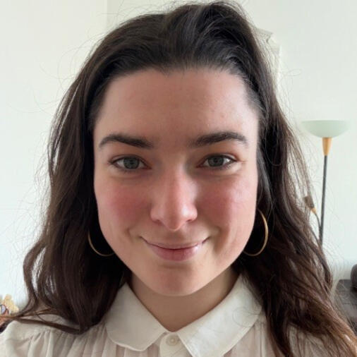 Picture of Emily Matthews Portrait pucture of Emily Matthews, dark brunette hair, smiling woman
